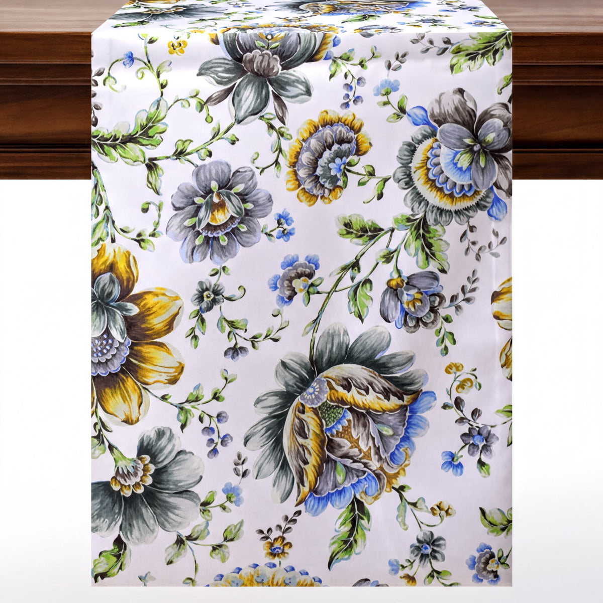 a table runner with a floral pattern in shades of blue, yellow, and green.