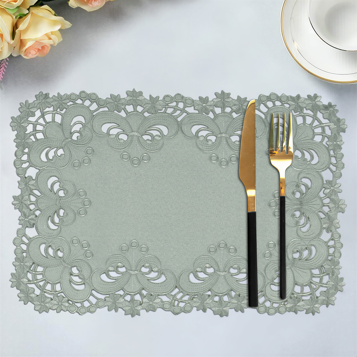 Set of six linen placemats with elegant European embroidery from the Creola Collection, stylish table setting accessory.