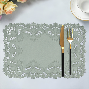 Set of six linen placemats with elegant European embroidery from the Creola Collection, stylish table setting accessory.
