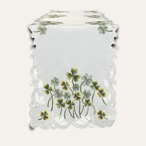 Ivory linen table runner with intricate European embroidery from The Clem Collection, showcasing elegant handmade design.