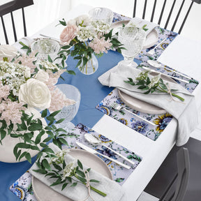 Set of four floral design cork-backed placemats by ATKP-9CK, decorative and protective for dining tables.
