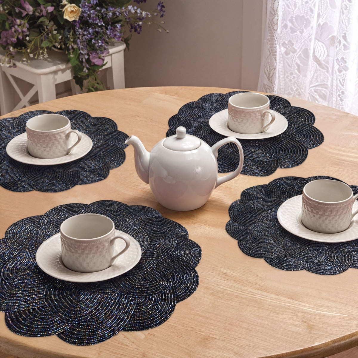 Embroidered beaded placemat from the Meribelle collection, featuring intricate beadwork and embroidery for elegant table settings.