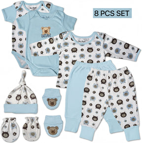 A set of baby clothing and accessories, including a blue onesie, a blue shirt with a bear, a blue hat, a blue sock, and a pair of blue pants with a bear pattern.