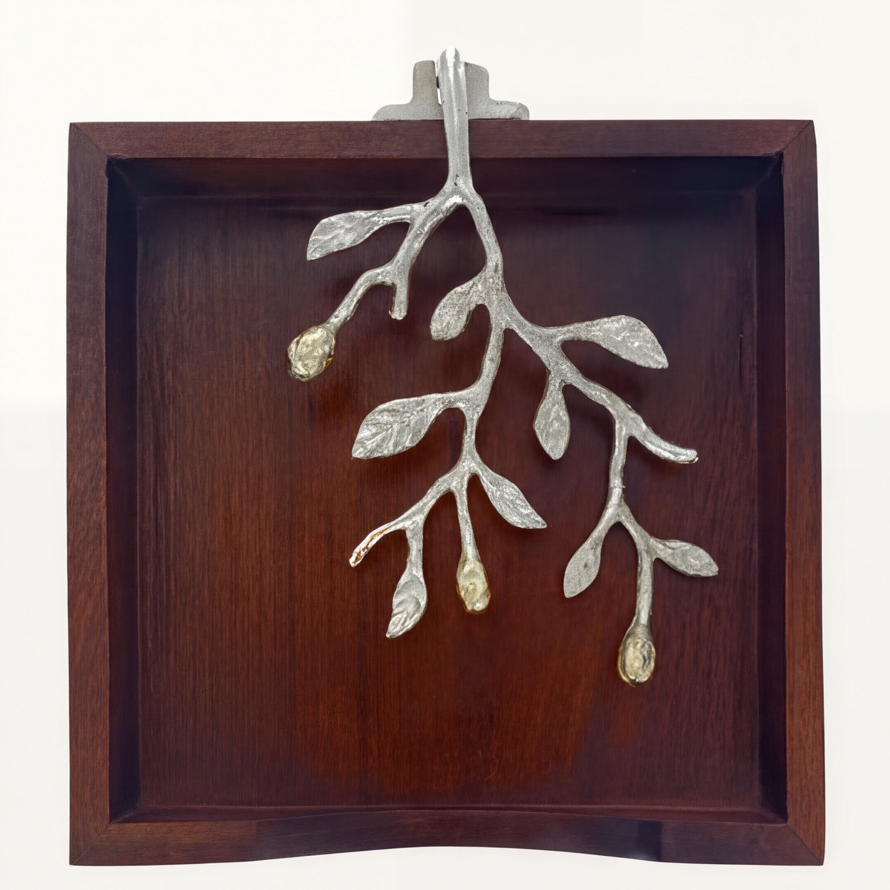 Solid wood napkin holder with silver and gold finish ornament, elegant design for stylish table settings.