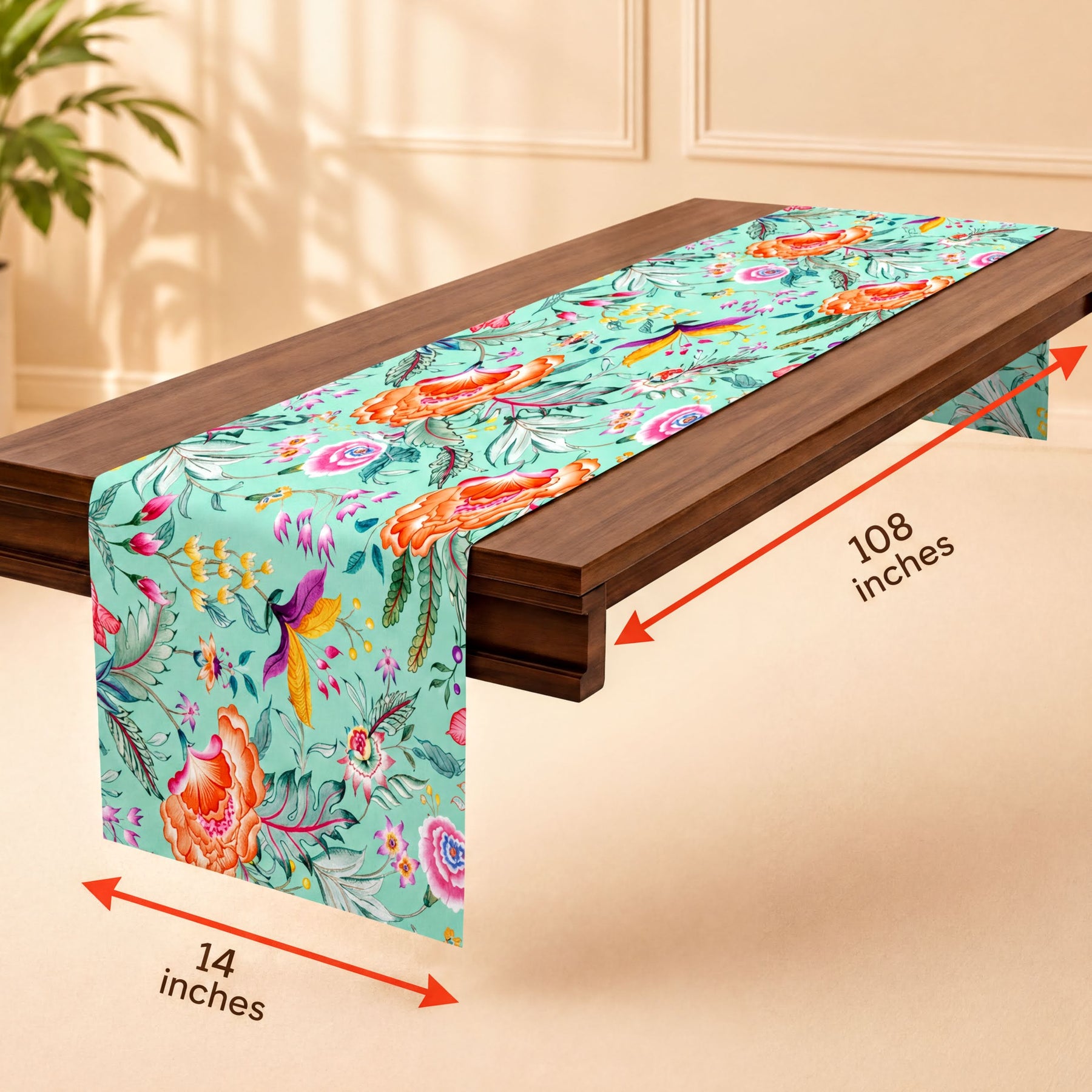 A table runner with a floral pattern is placed on a wooden table.