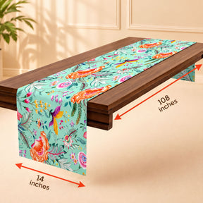 A table runner with a floral pattern is placed on a wooden table.