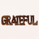Hand-carved wooden sculpture titled Gratitude Bloom, elegant decorative wooden décor piece for home display by PAT017.