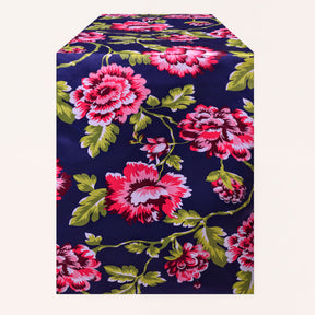 Blue printed table runner from RN-1 with intricate patterns, laid out on a table for a decorative dining setting.