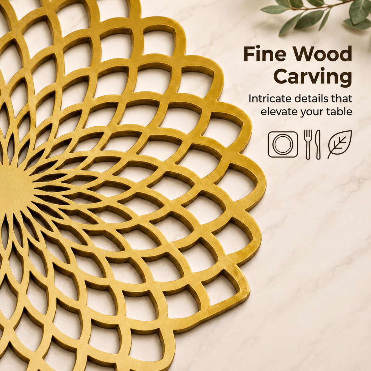 a close-up view of a decorative gold-colored wooden carving on a marble surface.