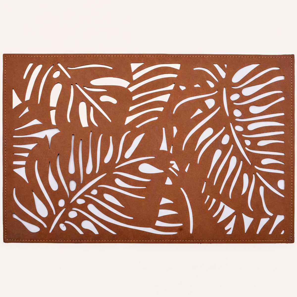 Set of six Monstera leaf cut out leather placemats by ACM1247-BRN, featuring tropical leaf design for table decor.