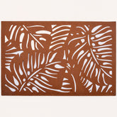 Set of six Monstera leaf cut out leather placemats by ACM1247-BRN, featuring tropical leaf design for table decor.