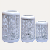 White lattice pattern candle lantern with glass holder, small size, ideal for decorative lighting in indoor or outdoor spaces.