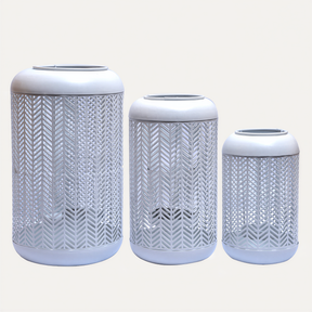 White lattice pattern candle lantern with glass holder, small size, ideal for decorative lighting in indoor or outdoor spaces.