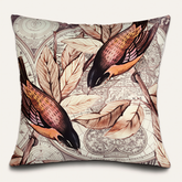 a decorative pillow with a repeating pattern of birds and leaves on a map background.