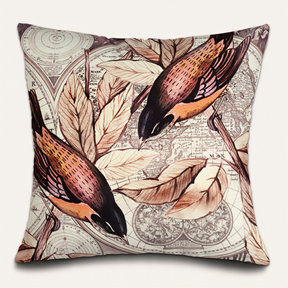 a decorative pillow with a repeating pattern of birds and leaves on a map background.