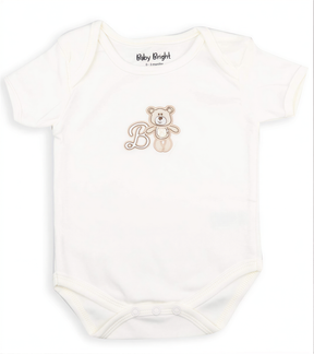 A white baby onesie with a teddy bear printed on it.