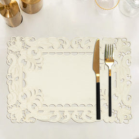 Set of six linen placemats with European embroidery from The Damarcus Collection, featuring intricate woven designs.
