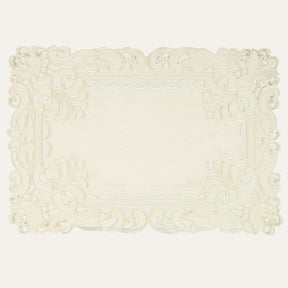Set of six linen placemats with elegant European embroidery from The Damarcus Collection, perfect for stylish table settings.