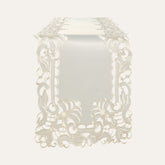 Light beige linen table runner with elegant European embroidery, designed by F308-RN for a sophisticated dining setting.