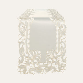 Light beige linen table runner with elegant European embroidery, designed by F308-RN for a sophisticated dining setting.