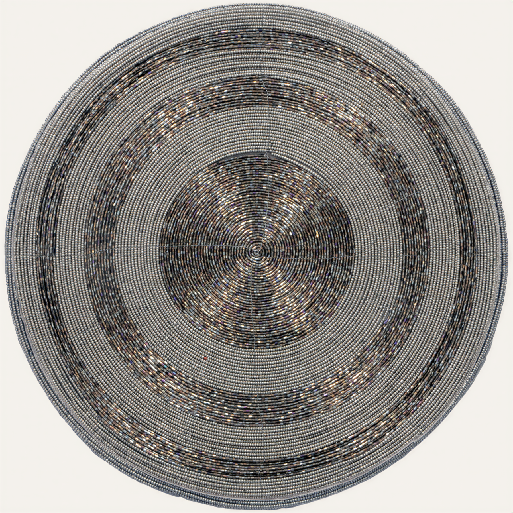 Set of four Vaiga Grace beaded placemats from The Vaiga Collection, elegant 14-inch decorative dining table decor.