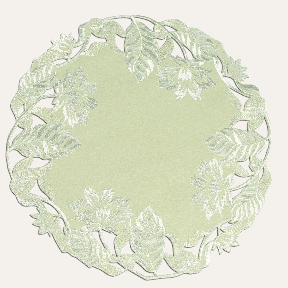 Set of four light green round linen doilies from The Daulton Collection, perfect for table decor and protect surfaces.