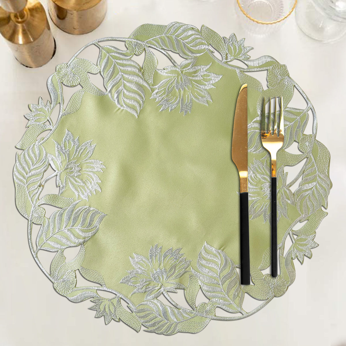 Set of four light green round linen doilies from The Daulton Collection, decorative placemats with intricate linen texture.