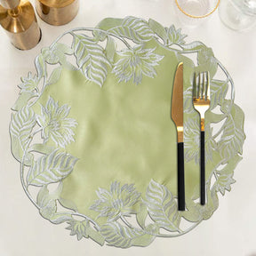 Set of four light green round linen doilies from The Daulton Collection, decorative placemats with intricate linen texture.