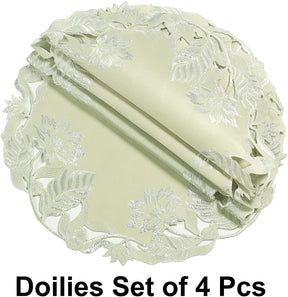 Set of four light green round linen placemat doilies from The Daulton Collection, decorative and crafted for table settings.