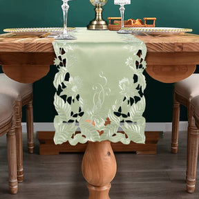 Linen table runner with intricate European embroidery, featuring elegant floral patterns, ideal for sophisticated dining decor.