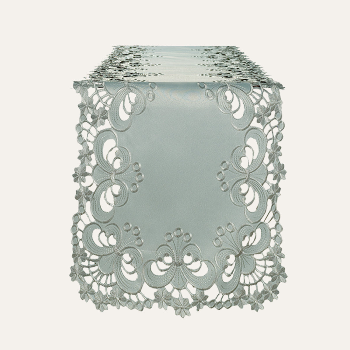 Linen table runner with intricate European embroidery from The Creola Collection, showcasing detailed floral patterns and elegant craftsmanship.
