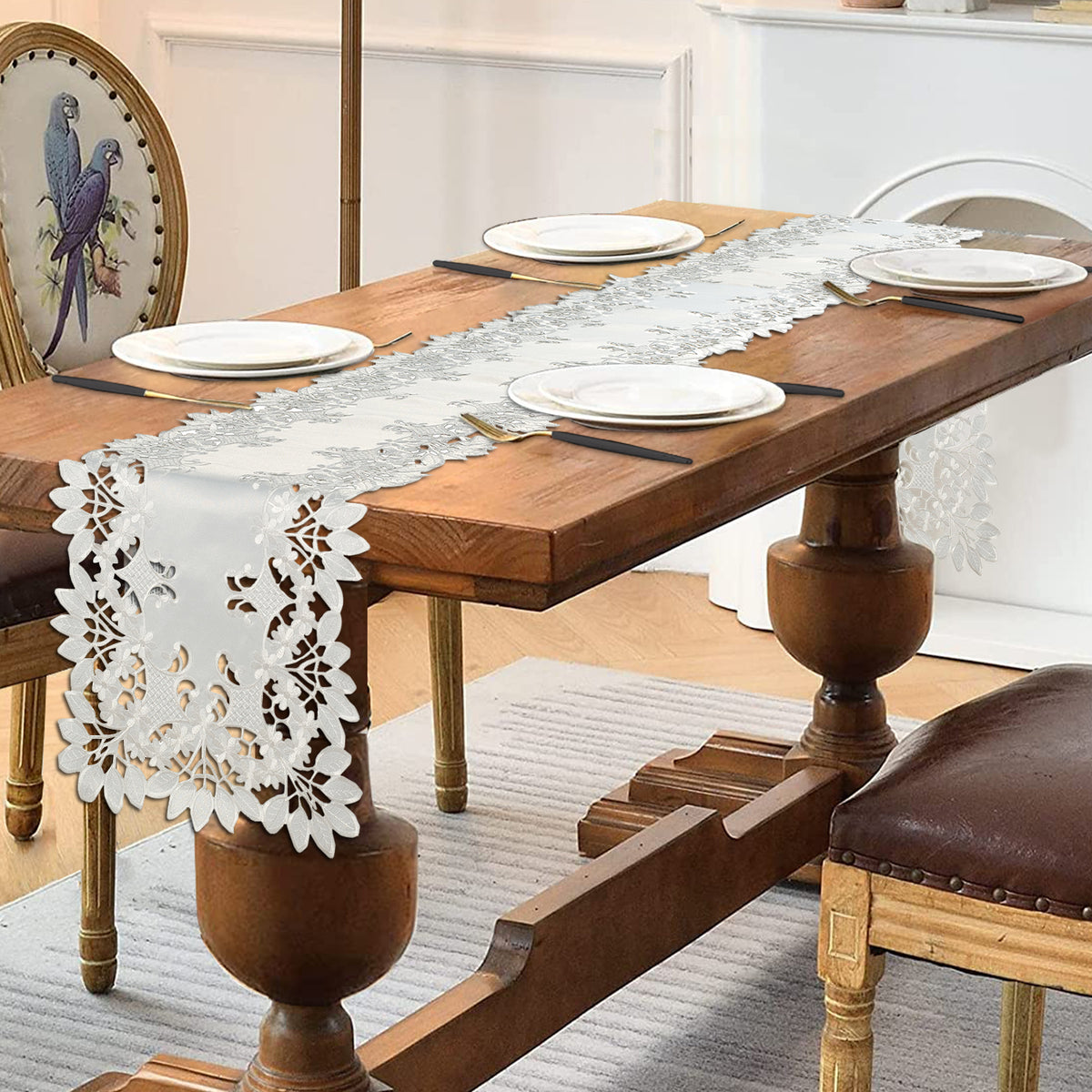 Linen table runner with intricate European embroidery from The Deandra Collection, showcasing elegant craftsmanship and detailed design.