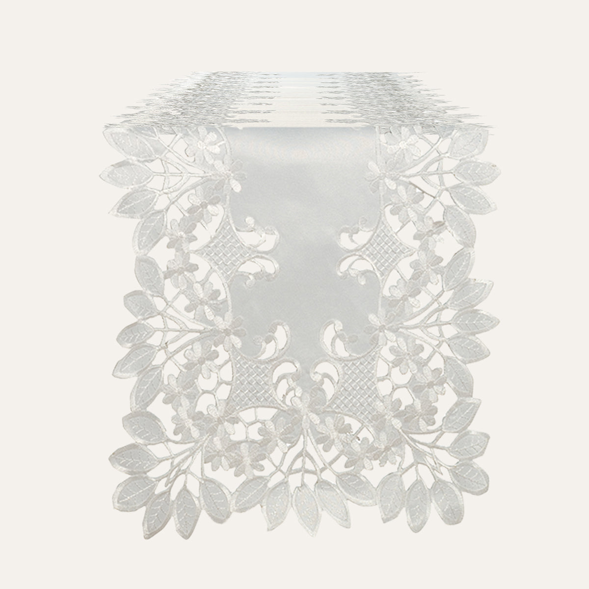 Linen table runner with intricate European embroidery from The Deandra Collection, featuring detailed floral patterns.