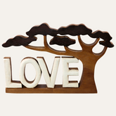 Hand-carved wooden sculpture titled Elmija Enduring Love, a handmade decorative wooden décor piece for home art.