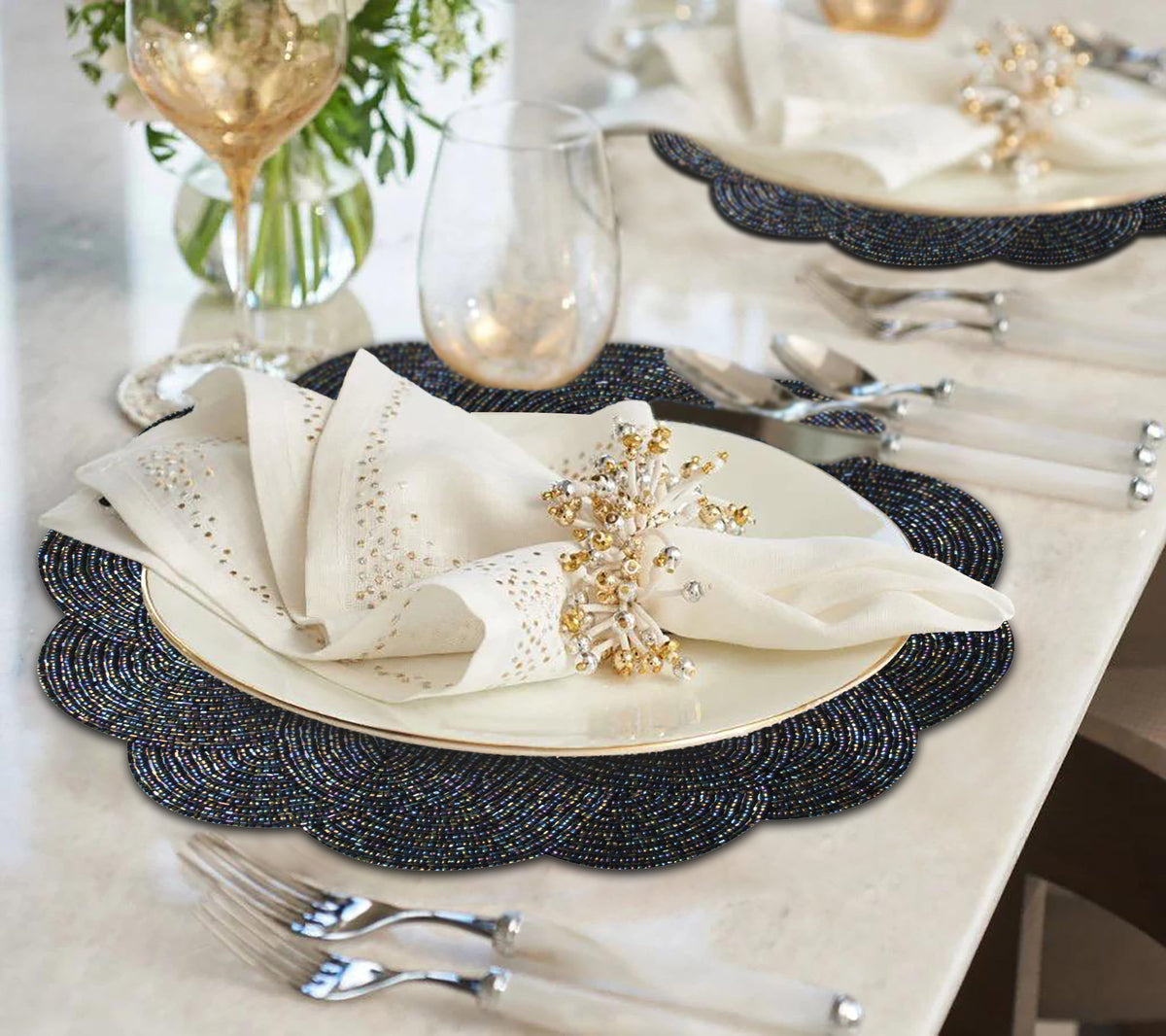 Embroidered beaded placemat from The Meribelle Beaded Placemats set, featuring intricate beadwork on a decorative fabric surface.