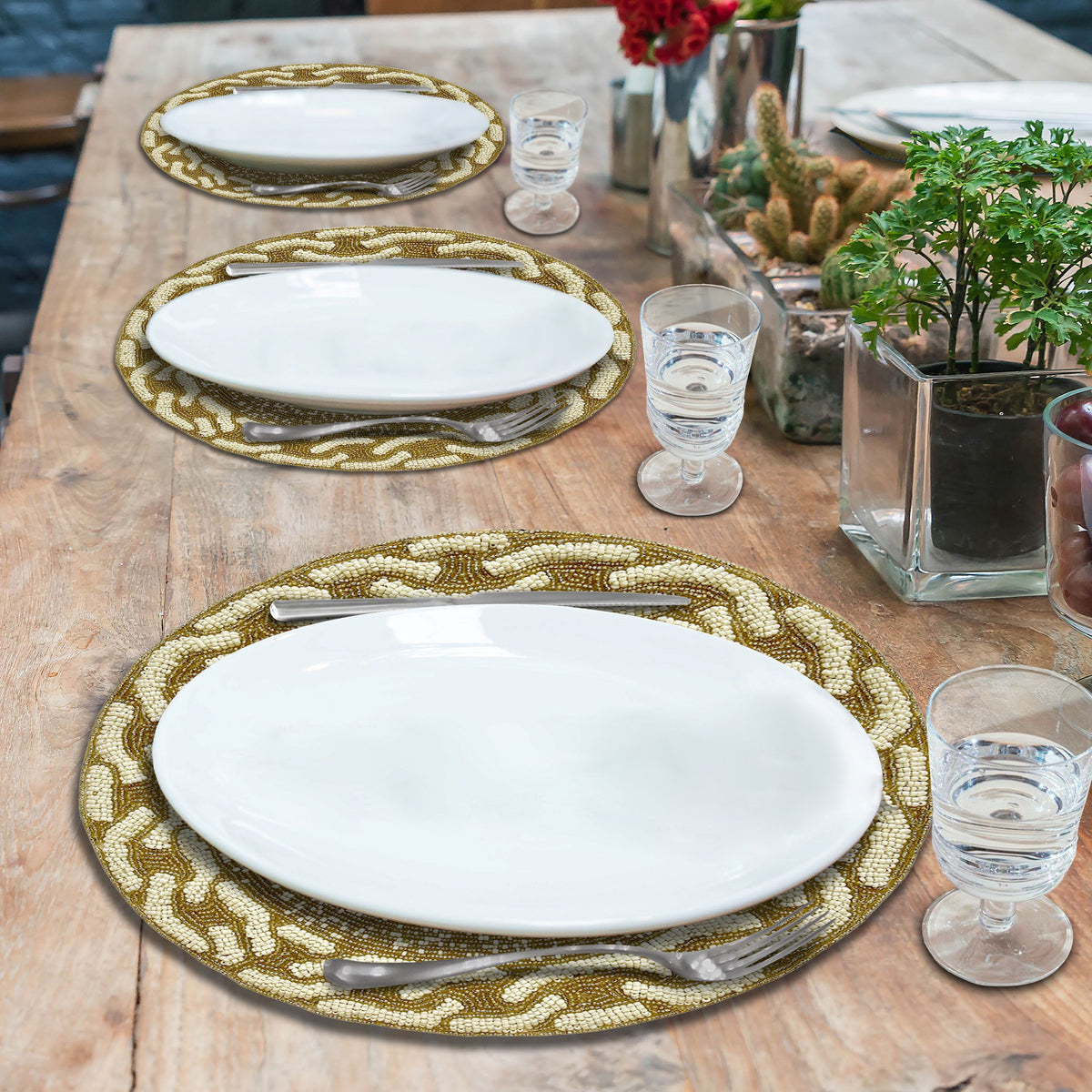 Embroidered beaded placemat from The Floy collection, featuring intricate beadwork and elegant design for table setting.