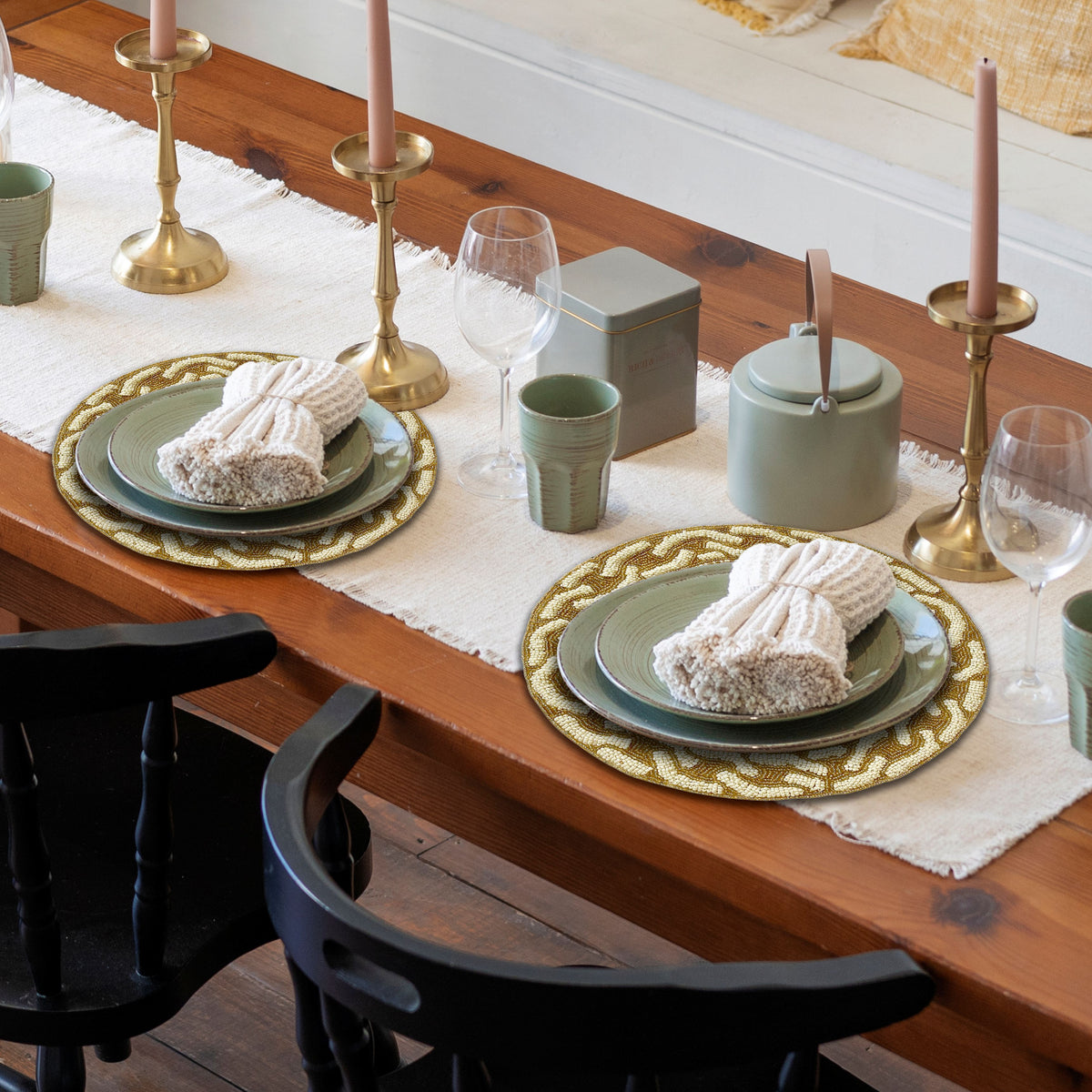 Embroidered beaded placemat from The Floy by PM1019, showing intricate beadwork on a stylish table setting.