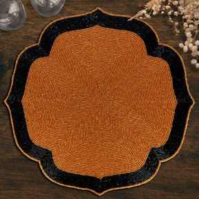 Set of two Amber Noir beaded placemats with embroidered warm copper and black beads, heat-resistant 14-inch table décor.