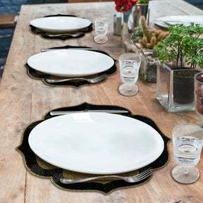 Set of two Midnight Ember embroidered beaded placemats in gold and black, heat-resistant 14-inch table décor for elegant dining.