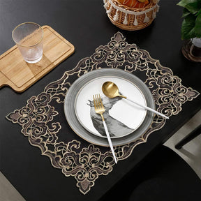 Set of four Noir Luxe black and gold table placemats from RIZ-004-PM Granada Collection, modern 12x18 inch dining décor.