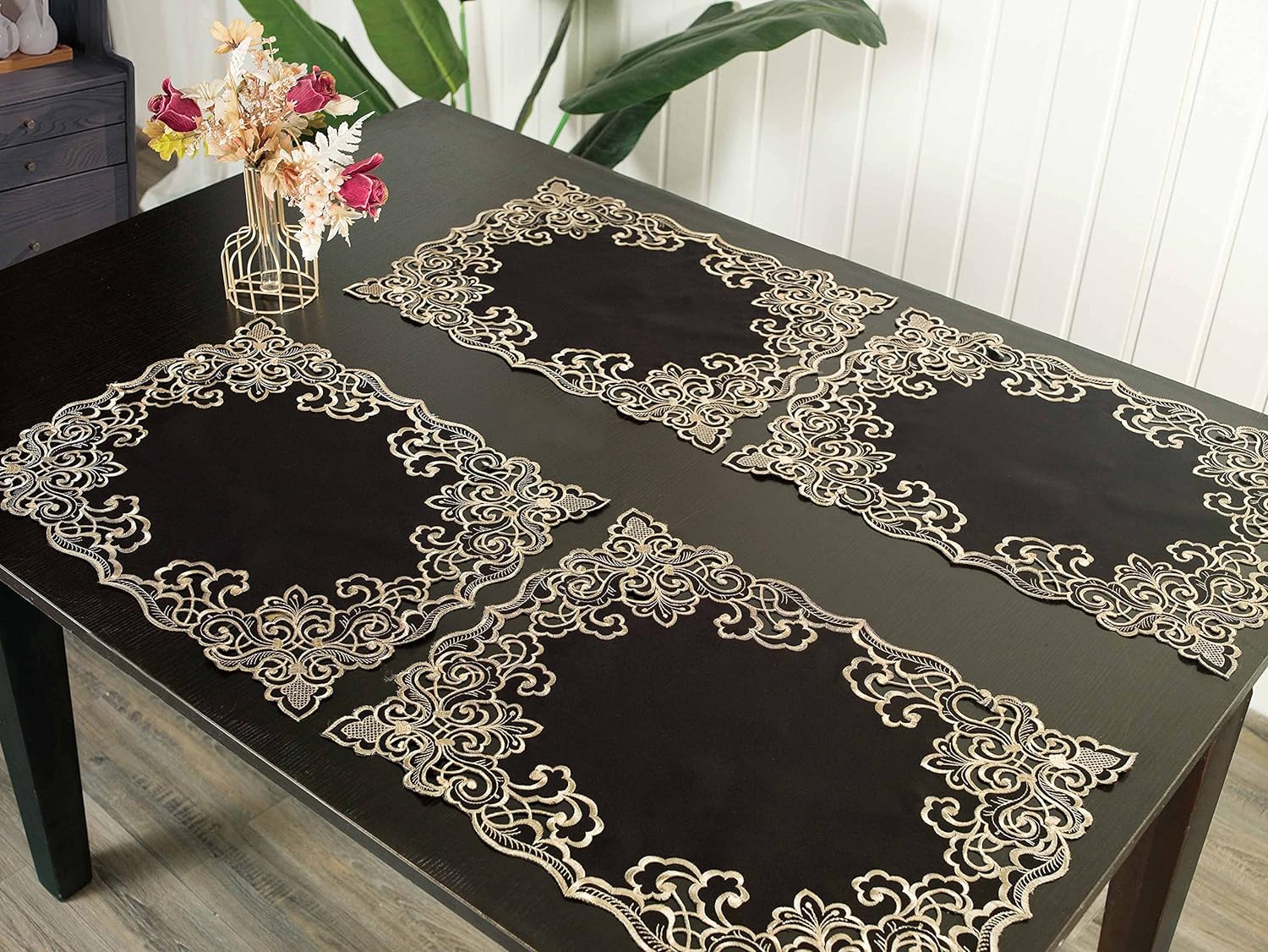 Set of four Noir Luxe black and gold placemats from the Granada Collection, modern 12x18 inch dining table décor.