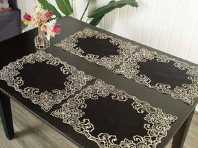 Set of four Noir Luxe black and gold placemats from the Granada Collection, modern 12x18 inch dining table décor.