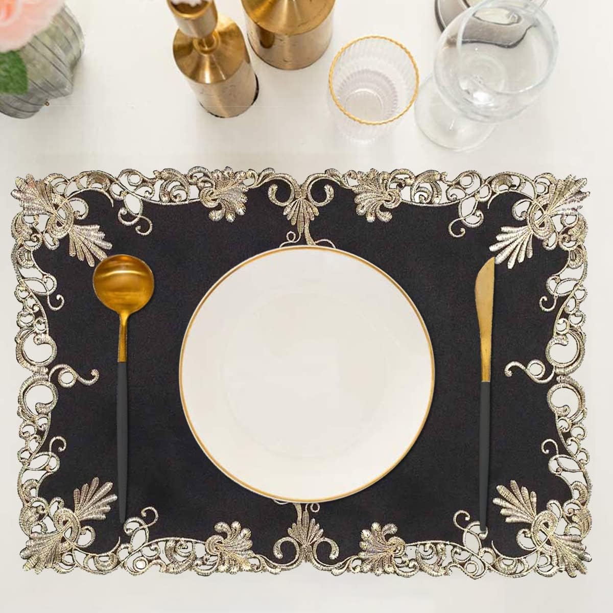 Set of four black and gold table placemats from RIZ-008-PM Chantelle Collection, featuring elegant design for dining tables.