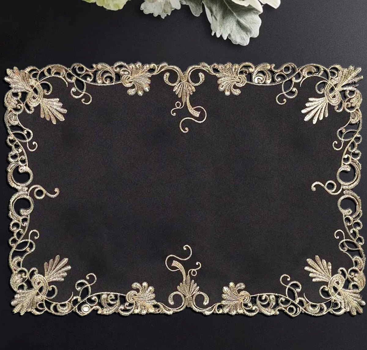 Set of four black and gold RIZ-008-PM Chantelle Collection placemats for table decoration and protection.