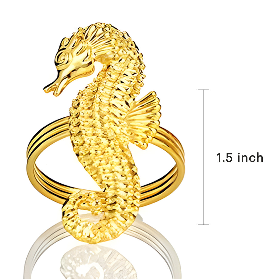 Set of four Ocean Majesty gold napkin rings featuring elegant sea horse design, perfect for luxurious dining table decor.