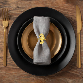 Set of four Ocean Majesty ZWZ-18-106-1 gold sea horse napkin rings, luxurious decorative dining table accents.