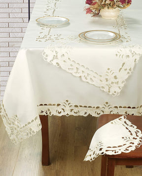 Set of six linen placemats from The Damarcus Collection with elegant European embroidery, perfect for sophisticated table settings.