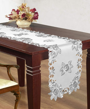 Linen table runner with intricate European embroidery, showcasing detailed craftsmanship on a stylish fabric.