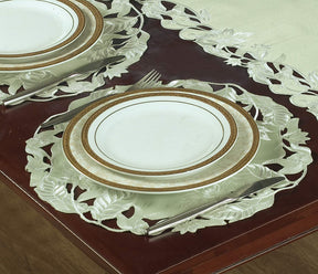 Set of four light green round linen placemat doilies from The Daulton Collection, perfect for table decor.