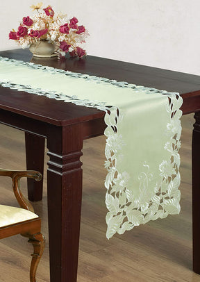 Linen table runner with intricate European embroidery, showcasing detailed craftsmanship and elegant design.